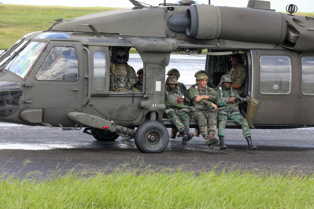 Soldiers conduct parachute jump training in Guyana.