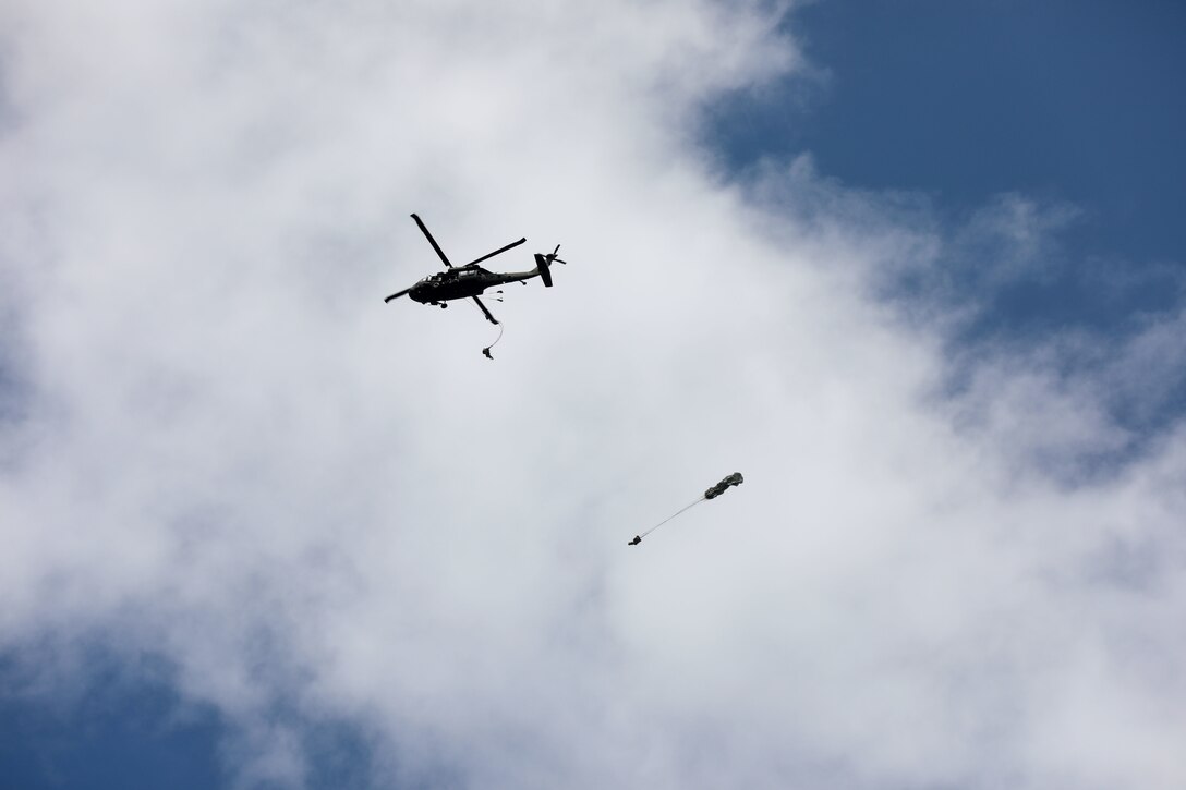 Soldiers conduct parachute jump training in Guyana.