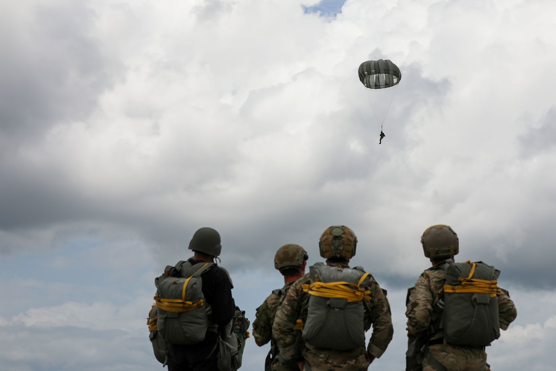 Soldiers conduct parachute jump training in Guyana.