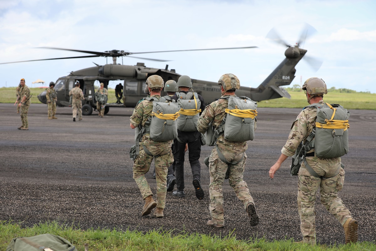 Soldiers conduct parachute jump training in Guyana.