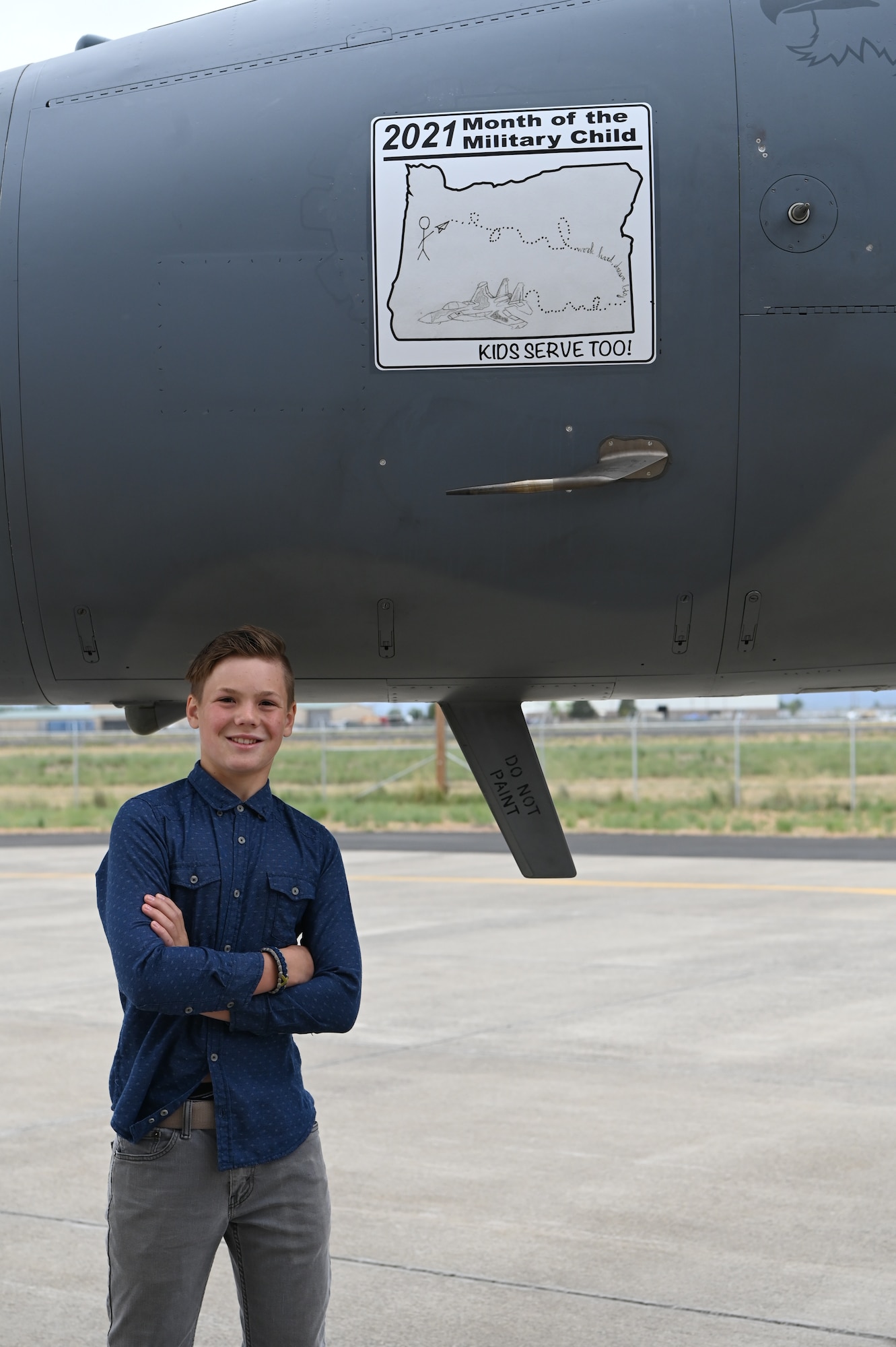 Child poses in front of F-15 Eagle