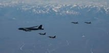 Royal Canadian Air Force CF-18 Hornet and United States Air Force F-16 Fighting Falcon fighter jets fly in formation with a United States Air Force B-52 Stratofortress over Alaska, during Exercise Amalgam Dart 21-1, June 15, 2021.
