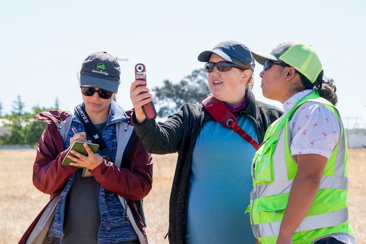 Karen Gallardo Cruz, left, Dr. Lyndsay Rankin, center, both Colorado State University wildlife biologists and Leslie Peña, 60th Civil Engineer Squadron Natural Resource Program manager, record time, date, temperature and global positioning system measurements while conducting a survey June 11, 2021, at Travis Air Force Base, California. Travis AFB’s Natural Resources Program is responsible for surveys, analysis and documentation of threatened and endangered species, wetlands, forest resources and other field studies. (U.S. Air Force photo by Heide Couch)