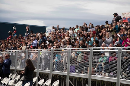 Family and friends recieve the graduating cadets with applause at the Alaska Military Youth Academy graduation ceremony, held at the Bartlett High School Football Field in Anchorage, June 18, 2021. The ceremony featured Alaska Lt. Gov. Kevin Meyer as the keynote speaker for the 79 graduating cadets and their families. (U.S Army National Guard photo by Victoria Granado)