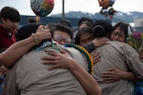 Alaska Military Youth Academy cadets embrace their families after AMYA's graduation ceremony, held at the Bartlett High School Football Field in Anchorage, June 18, 2021. The ceremony featured Alaska Lt. Gov. Kevin Meyer as the keynote speaker for the 79 graduating cadets and their families. (U.S Army National Guard photo by Victoria Granado)