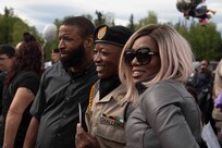 An Alaska Military Youth Academy cadet meets his family after AMYA's graduation ceremony, held at the Bartlett High School Football Field in Anchorage, June 18, 2021. The ceremony featured Alaska Lt. Gov. Kevin Meyer as the keynote speaker for the 79 graduating cadets and their families. (U.S Army National Guard photo by Victoria Granado)