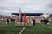 The Alaska Military Youth Academy color guard team presents the colors while the national anthem plays during AMYA's graduation ceremony, held at the Bartlett High School Football Field in Anchorage, June 18, 2021. The ceremony featured Alaska Lt. Gov. Kevin Meyer as the keynote speaker for the 79 graduating cadets and their families. (U.S Army National Guard photo by Victoria Granado)