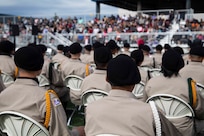 Alaska Military Youth Academy cadets stay seated during the keynote speech at AMYA's graduation ceremony, held at the Bartlett High School Football Field in Anchorage, June 18, 2021. The ceremony featured Alaska Lt. Gov. Kevin Meyer as the keynote speaker for the 79 graduating cadets and their families. (U.S Army National Guard photo by Victoria Granado)