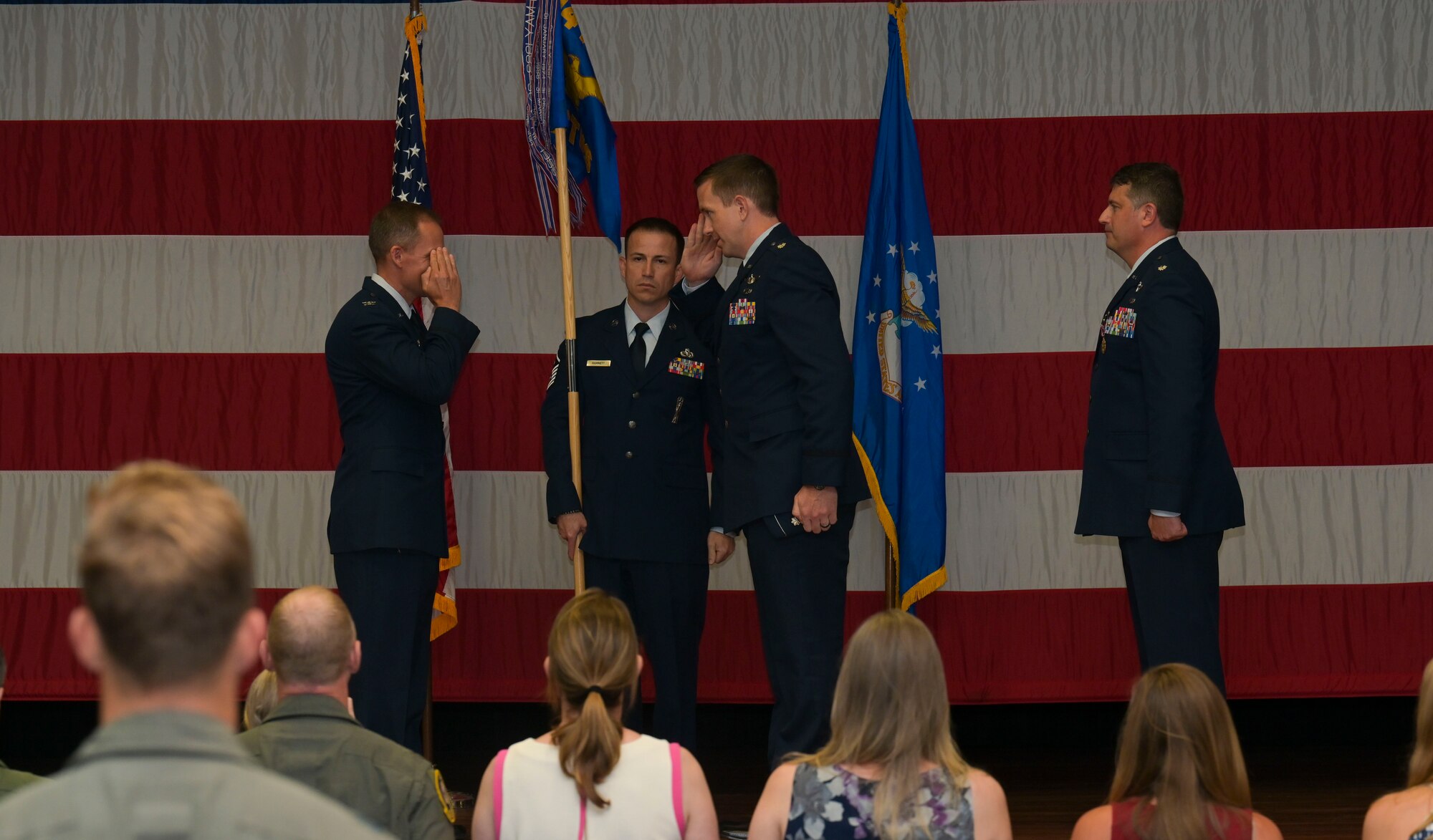 U.S. Air Force Col. Justin Spears, 14th Operations Group commander, Lt. Col. Courtland Stanley, incoming 14th Student Squadron commander, and Lt. Col. Joseph McCane, outgoing 14th STUS commander, pass the guidon,  during a the 14th STUS Change of Command ceremony, June 21, 2021, on Columbus Air Force Base, Miss. The 14th Student Squadron ranks as the largest squadron at Columbus AFB, consisting of 21 active duty and 82 civilian permanent party personnel as well as approximately 700 student pilots from 25 different nations. (U.S. Air Force photo by Airman 1st Class Jessica Haynie)