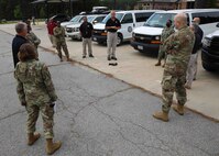 FORT LEE, Va. (June 22, 2021) Tim Fahey, the Joint Task Force Civil Support joint movement center division chief, middle, gives a safety brief to forward command element personnel prior to air load training on Fort Lee, Virginia during Exercise Lightning Response, June 22, 2021.