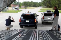 FORT LEE, Va. (June 22, 2021) Randy Hall, the Joint Task Force Civil Support commander’s action group leader, left, guides a forward command element vehicle as it backs onto a C-17 Globemaster III load trainer on Fort Lee, Virginia during Exercise Lightning Response, June 22, 2021.