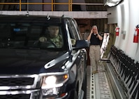 FORT LEE, Va. (June 22, 2021) Randy Hall, the Joint Task Force Civil Support commander’s action group leader, guides Air Force Lt. Col. Timothy Lundberg onto a C-17 Globemaster III load trainer during Exercise Lightning Response on Fort Lee, Virginia, June 22, 2021.