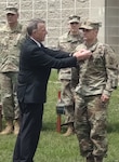 U.S. Army Sgt. 1st Class Dustin Dearborn, a Vermont Army National Guard instructor at the Army Mountain Warfare School, is awarded the Soldier's Medal by Vermont Governor Phil Scott on June 18, 2021 at the Camp Ethan Allen Training Site in Jericho, Vermont. Between Feb. 28-March 1, 2020, Dearborn assisted with the rescue of two individuals at the Stowe Mountain ski area. One the military’s highest honors, the medal is awarded only for acts of heroism not involving conflict with an armed enemy. (U.S. Army National Guard photo by Joshua T. Cohen)