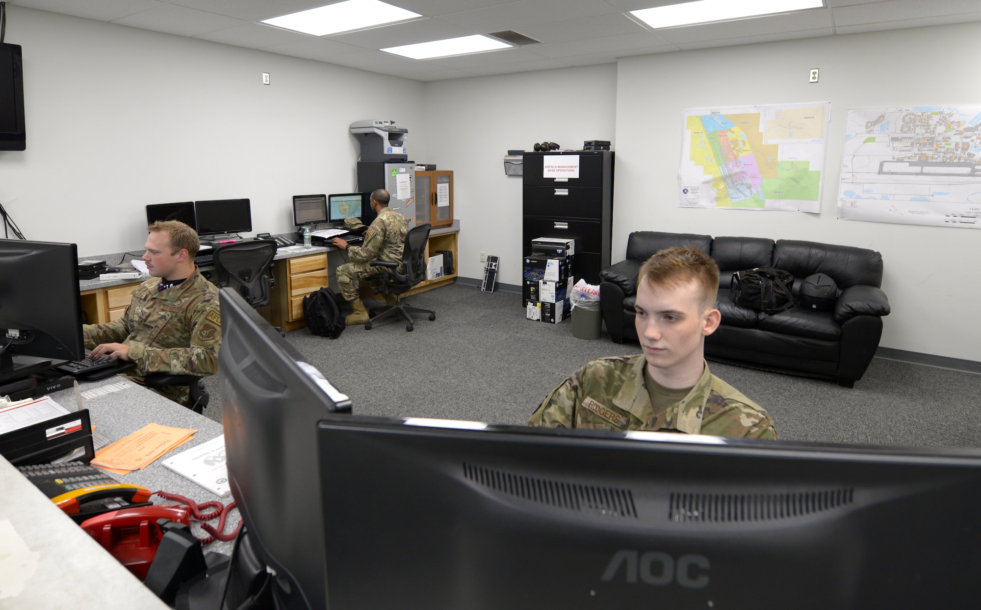 Airmen assigned to the 354th Operations Support Squadron (OSS)  and the 8th OSS Airfield Management Flights coordinate parking and log flight plans during RED FLAG-Alaska (RF-A)21-2 on Eielson Air Force Base, Alaska, June 21, 2021. To help ease the burden of RF-A’s higher operations tempo, a visiting unit will typically send one of their own airfield managers to augment with the host base’s unit. (U.S. Air Force photo by Senior Airman Beaux Hebert)