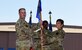 During the ceremony, Col. Mark Reynolds, 509th Medical Group commander, passed the unit flag to Lt. Col. Jessica Dees as a symbol of the continuity of authority between the outgoing and incoming commanders. (U.S. Air Force photo by Tech. Sgt. Heather Salazar)