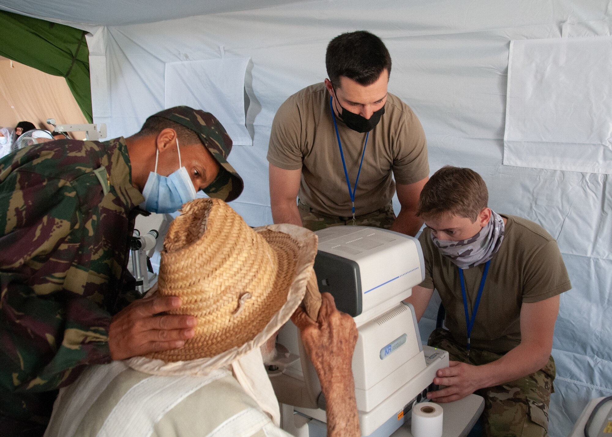 U.S. Military members conduct medical treatment on Moroccan civilians.