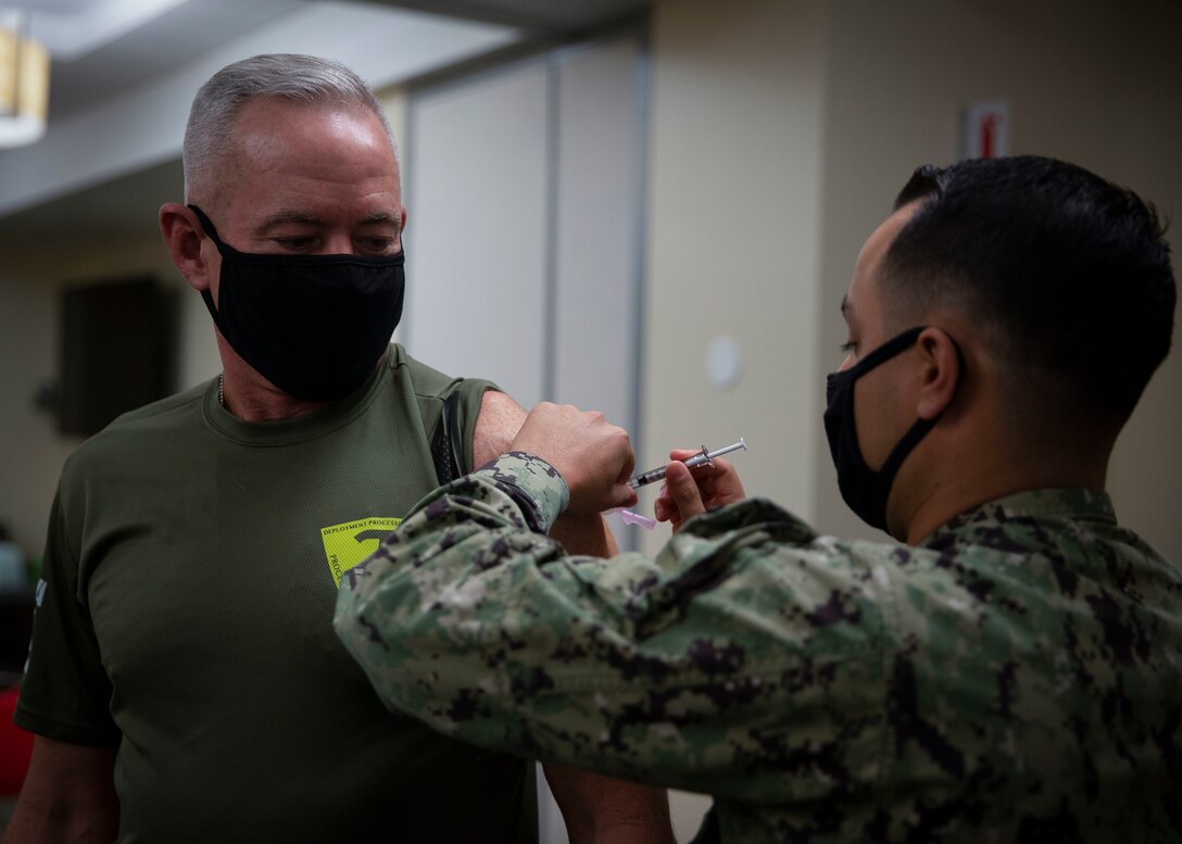 U.S. Marine Brig. Gen. Dan Conley, the commanding general of Marine Corps Installations West, Marine Corps Base Camp Pendleton, receives the COVID-19 vaccine at the naval hospital on Camp Pendleton, California, Jan. 12, 2021. While the COVID-19 vaccination is voluntary, all beneficiaries and Marine Corps personnel are strongly encouraged to be vaccinated to protect their health and their community. Vaccines are being administered in a phased approach, prioritizing healthcare workers and first responders, as well as mission critical and deploying personnel. Vaccination distribution prioritization within DOD, and the Marine Corps, will be consistent with data-driven CDC guidance for national prioritization. Marines will continue to wear appropriate masks, practice social distancing, regularly wash their hands, and follow restriction of movement guidelines to maintain the safety of others as a large portion of the population will need to be vaccinated before COVID-19 risks diminish. (U.S. Marine Corps photo by Sgt. Jeremy Laboy)
