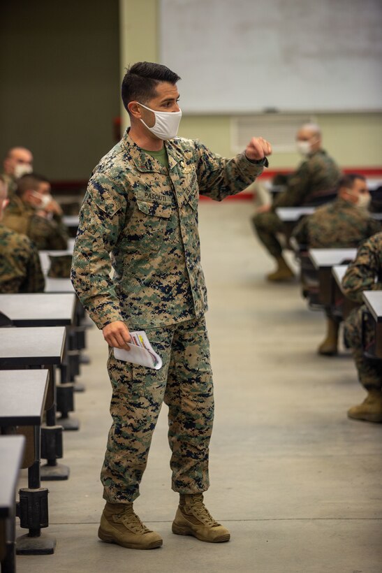 U.S. Marine Chief Warrant Officer 3 A.J. Pasciuti, the battalion gunner for Infantry Training Battalion, School of Infantry - West, gives a brief to students about the Infantry Marine Course on Marine Corps Base Camp Pendleton, California, Jan. 25, 2021. IMC is a 14-week pilot course designed to create better trained and more lethal entry-level infantry Marines prepared for near-peer conflicts. The course uses a redesigned learning model for students intended to develop their capabilities for independent and adaptive thought and action. The program of instruction for IMC has been in development for a year and follows guidance from the 2019 Commandant's Planning Guidance and Force Design 2030. Pasciuti is a native of San Jose, California. (U.S. Marine Corps photo by Lance Cpl. Kerstin Roberts)