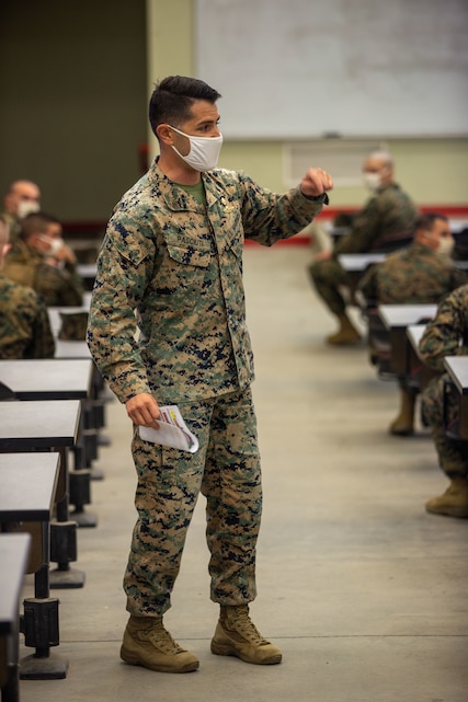 U.S. Marine Chief Warrant Officer 3 A.J. Pasciuti, the battalion gunner for Infantry Training Battalion, School of Infantry - West, gives a brief to students about the Infantry Marine Course on Marine Corps Base Camp Pendleton, California, Jan. 25, 2021. IMC is a 14-week pilot course designed to create better trained and more lethal entry-level infantry Marines prepared for near-peer conflicts. The course uses a redesigned learning model for students intended to develop their capabilities for independent and adaptive thought and action. The program of instruction for IMC has been in development for a year and follows guidance from the 2019 Commandant's Planning Guidance and Force Design 2030. Pasciuti is a native of San Jose, California. (U.S. Marine Corps photo by Lance Cpl. Kerstin Roberts)