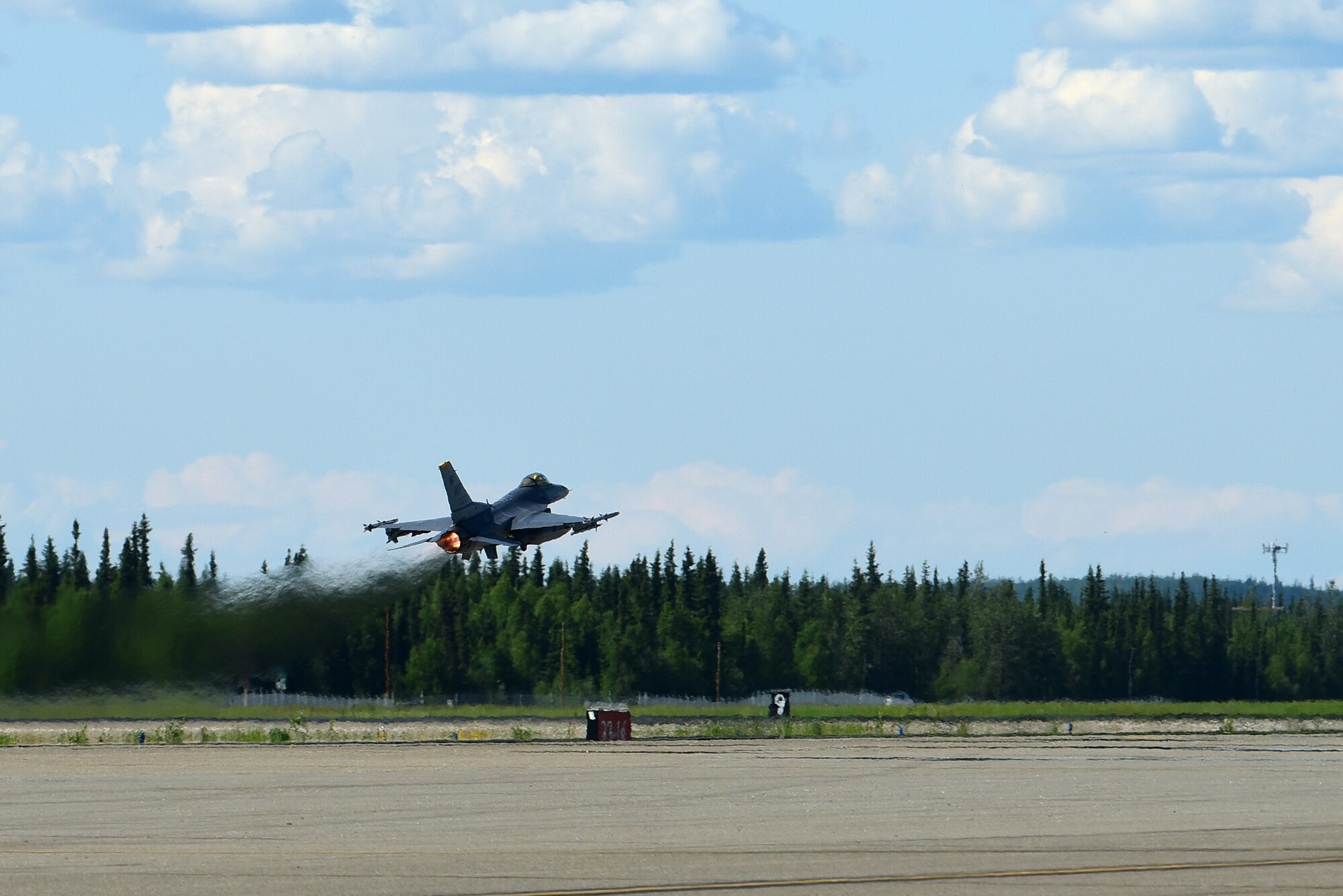 An F-16 Fighting Falcon takes off during Red Flag-Alaska 21-2 at Eielson Air Force Base, Alaska, June 16, 2021. RF-A is a Pacific Air Forces-directed field training exercise designed to provide U.S. and allied forces realistic air combat training for which enhances joint and bilateral interoperability in the Indo-Pacific region. (U.S. Air Force photo by Senior Airman Suzie Plotnikov)