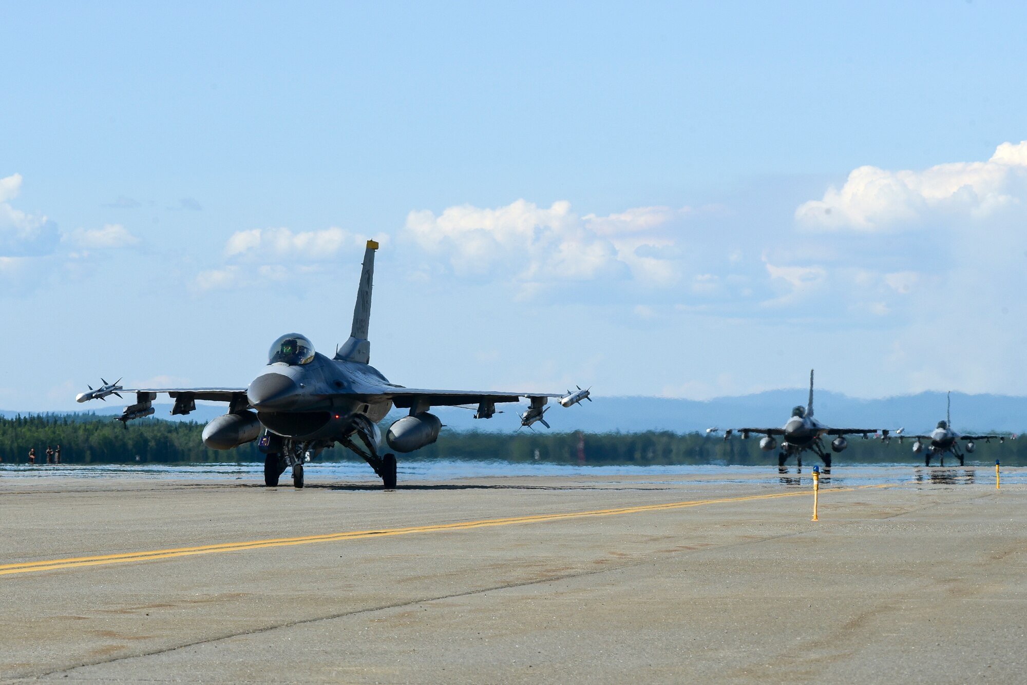 F-16 Fighting Falcons assigned to the 8th Fighter Wing, Kunsan Air Base, Republic of Korea, taxi before takeoff during Red Flag-Alaska 21-2 at Eielson Air Force Base, Alaska, June 16, 2021. RF-A is a Pacific Air Forces-directed field training exercise designed to provide realistic air combat training for U.S. and allied forces. (U.S. Air Force photo by Senior Airman Suzie Plotnikov)