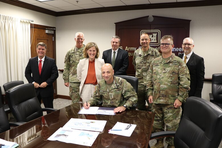 Lt. Gen. Scott A. Spellmon, center, is flanked by U.S. Army Corps of Engineers and Sacramento District leaders as he signs the Chief's Report to recommend moving forward with the Lower Cache Creek flood risk reduction project on June 21, 2021.