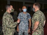 Capt. Chase Sargeant, commander, Task Force 71, Cmdr. Jeremy Carlson, commanding officer of Arleigh Burke-class guided-missile destroyer USS Benfold (DDG 65), and Republic of Singapore Navy (RSN) Col. Ooi Tjin Kai, deputy fleet commander, discuss Pacific Griffin 2021 during the opening ceremony. Pacific Griffin is considered the most complex and warfare-centric bilateral engagement between both navies and represents a continued investment in the strengthening of the solid partnership between the U.S. and Republic of Singapore.