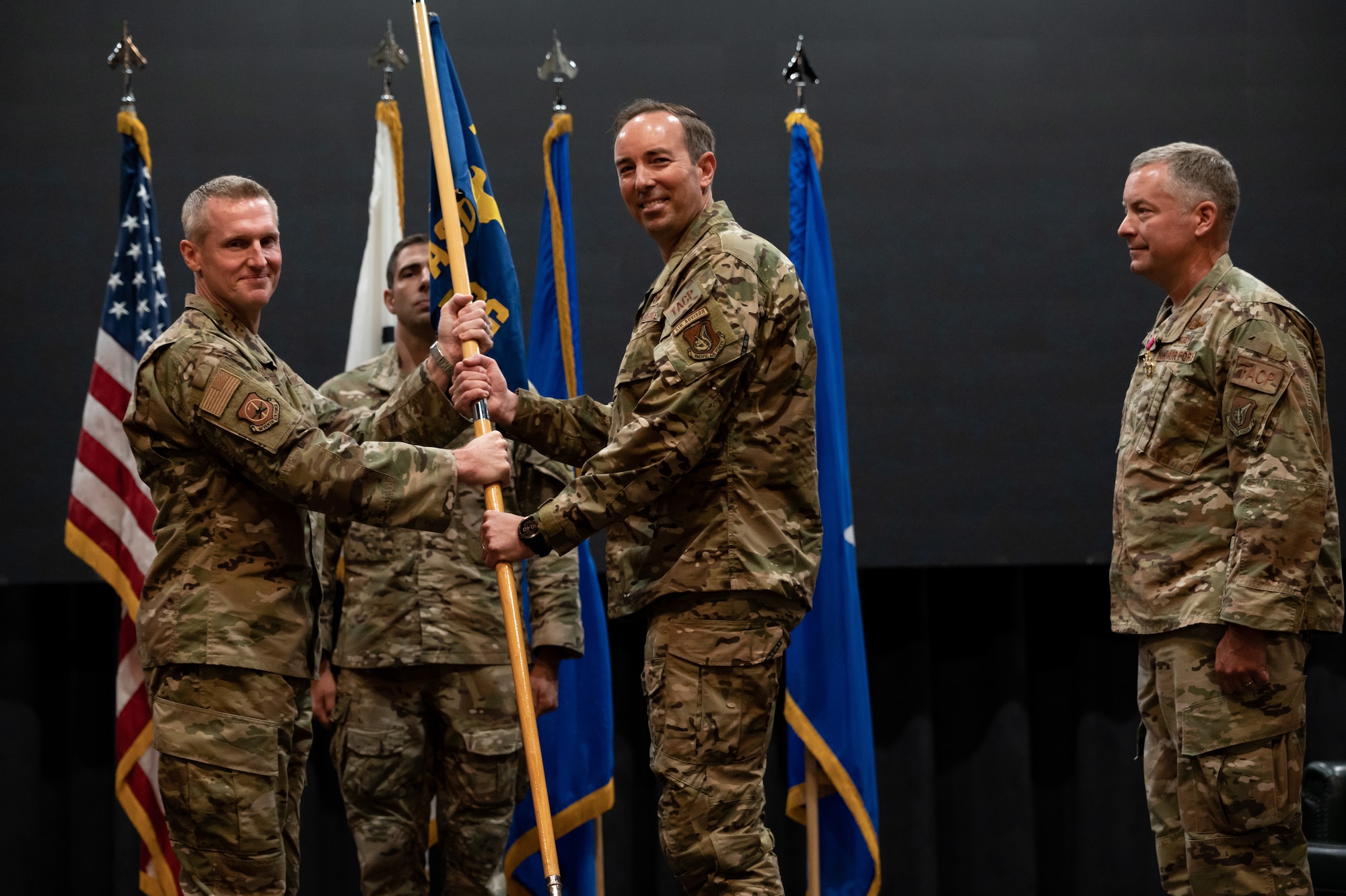 Brig. Gen. Jason Rueschhoff, 7th Air Force deputy commander, left, passes off the ceremonial guidon to Col. Scott Morgan, 607th Air Support Operations Group inbound commander, at Osan Air Base, Republic of Korea, June 22, 2021. This act marks the official beginning of Morgans command of the 607th ASOG. (U.S. Air Force photo by Tech. Sgt. Nicholas Alder)