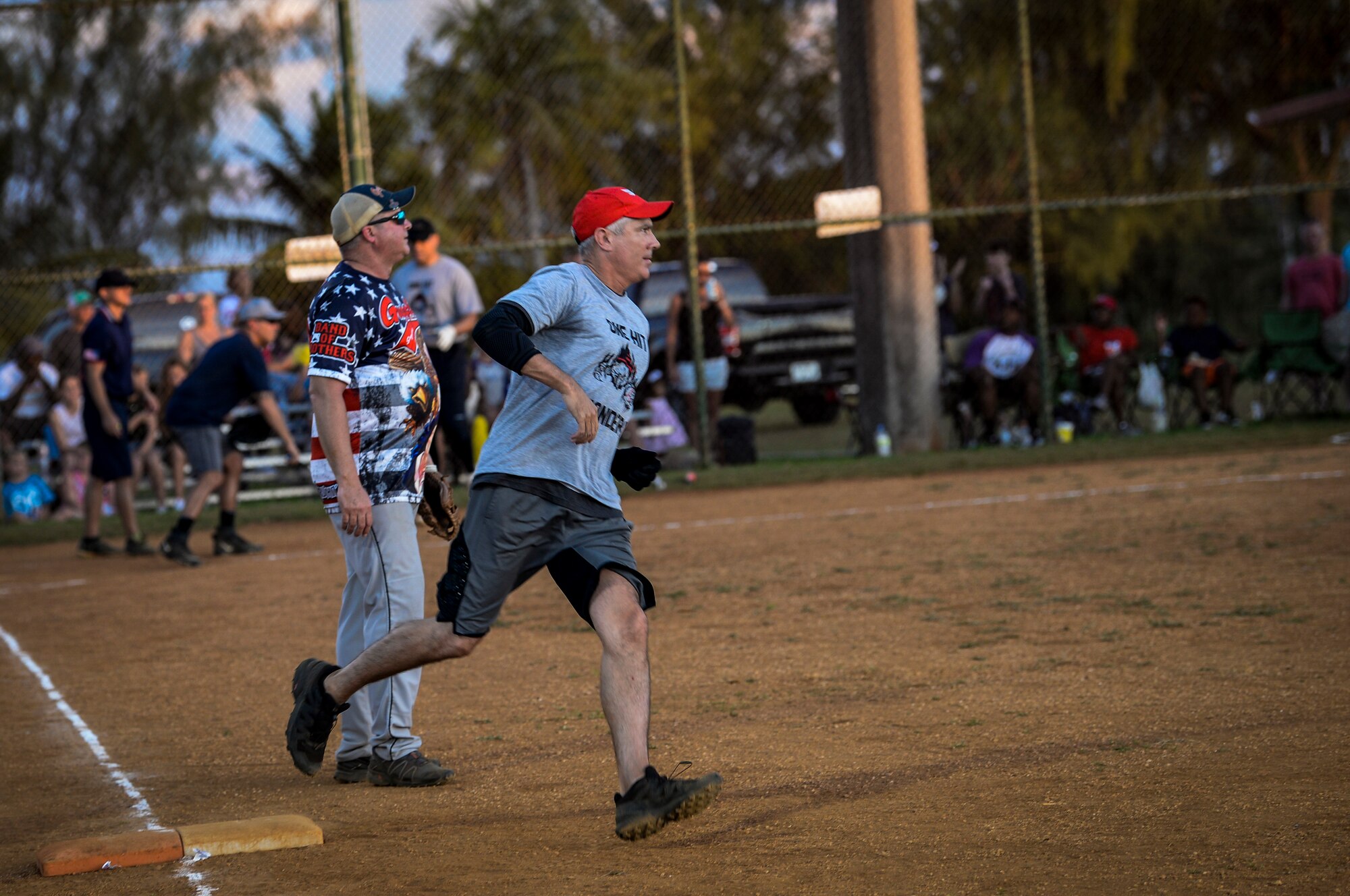 U.S. Air Force Brig. Gen. Jeremy Sloane, 36th Wing commander, runs passed first base during the Chief’s versus Eagle’s softball game at Andersen Air Force Base, Guam, June 18, 2021.