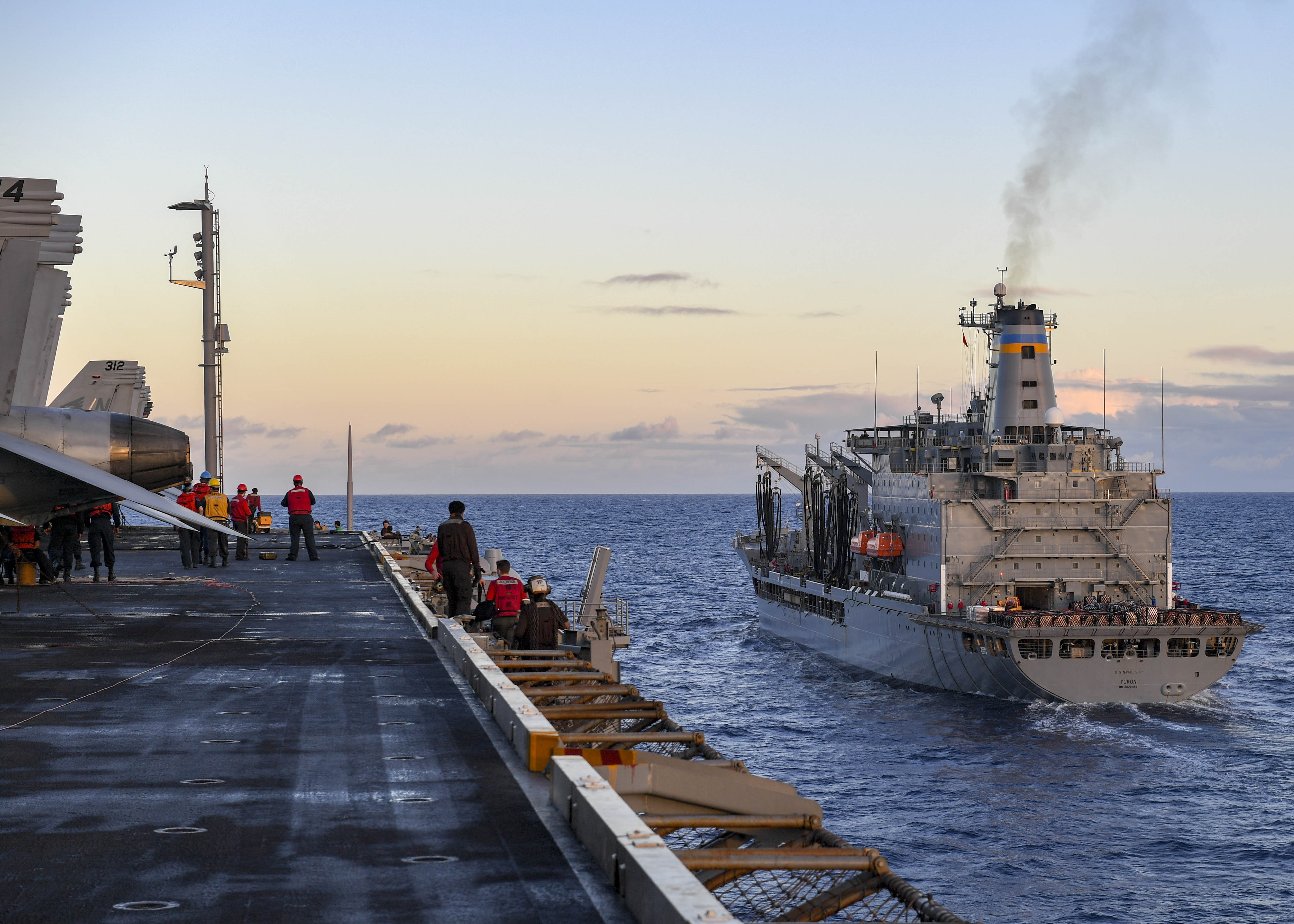 PACIFIC OCEAN (June 14, 2020) The fleet replenishment oiler USNS Yukon (T-AO 202) steams alongside the aircraft carrier USS Nimitz (CVN 68). Nimitz, the flagship of Carrier Strike Group 11, is deployed conducting maritime security operations and theater security cooperation efforts. (U.S. Navy photo by Mass Communication Specialist 3rd Class Olivia Banmally Nichols/Released)