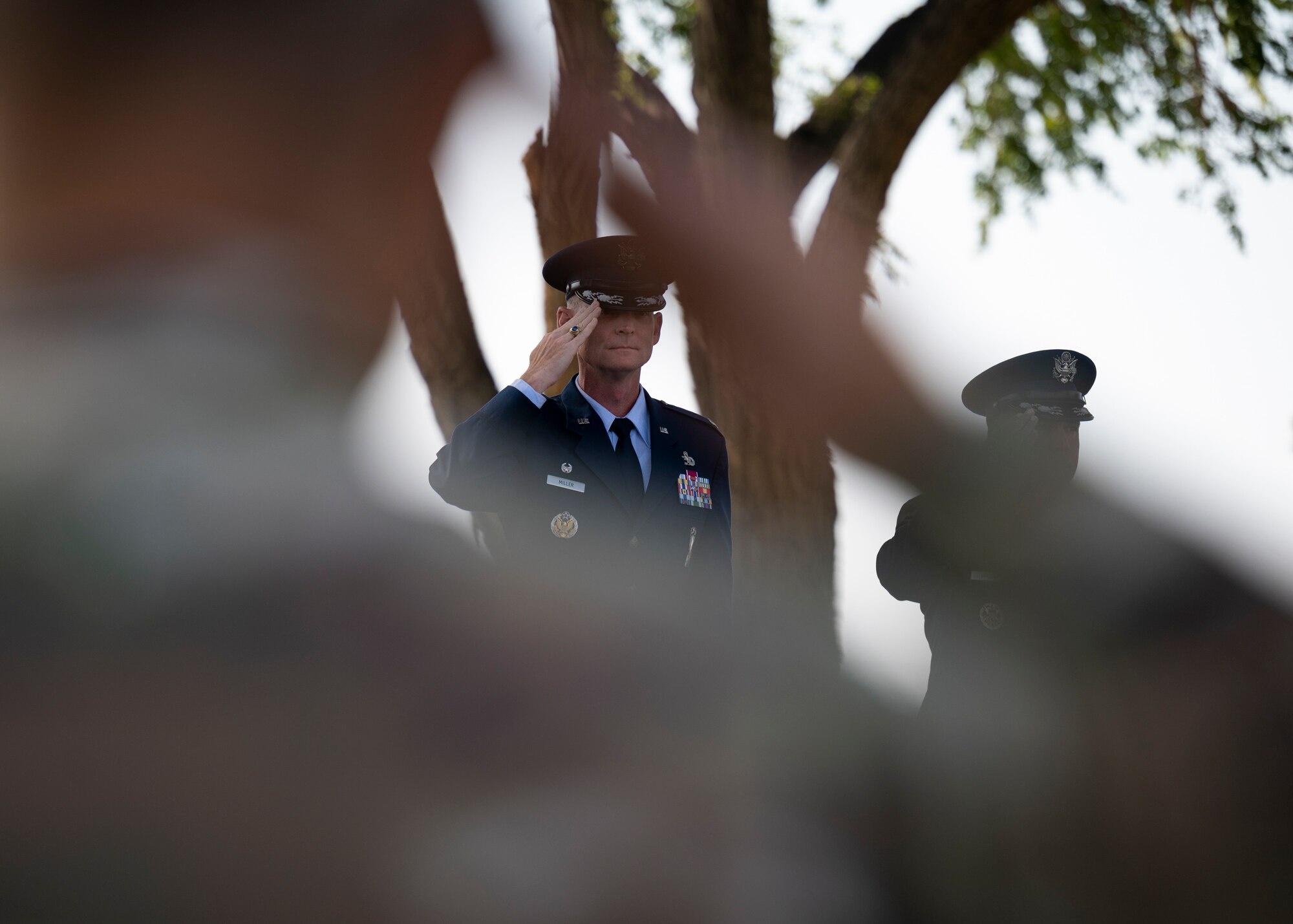 U.S. Air Force Col. David S. Miller, 377th Air Base Wing outgoing commander, renders a salute.