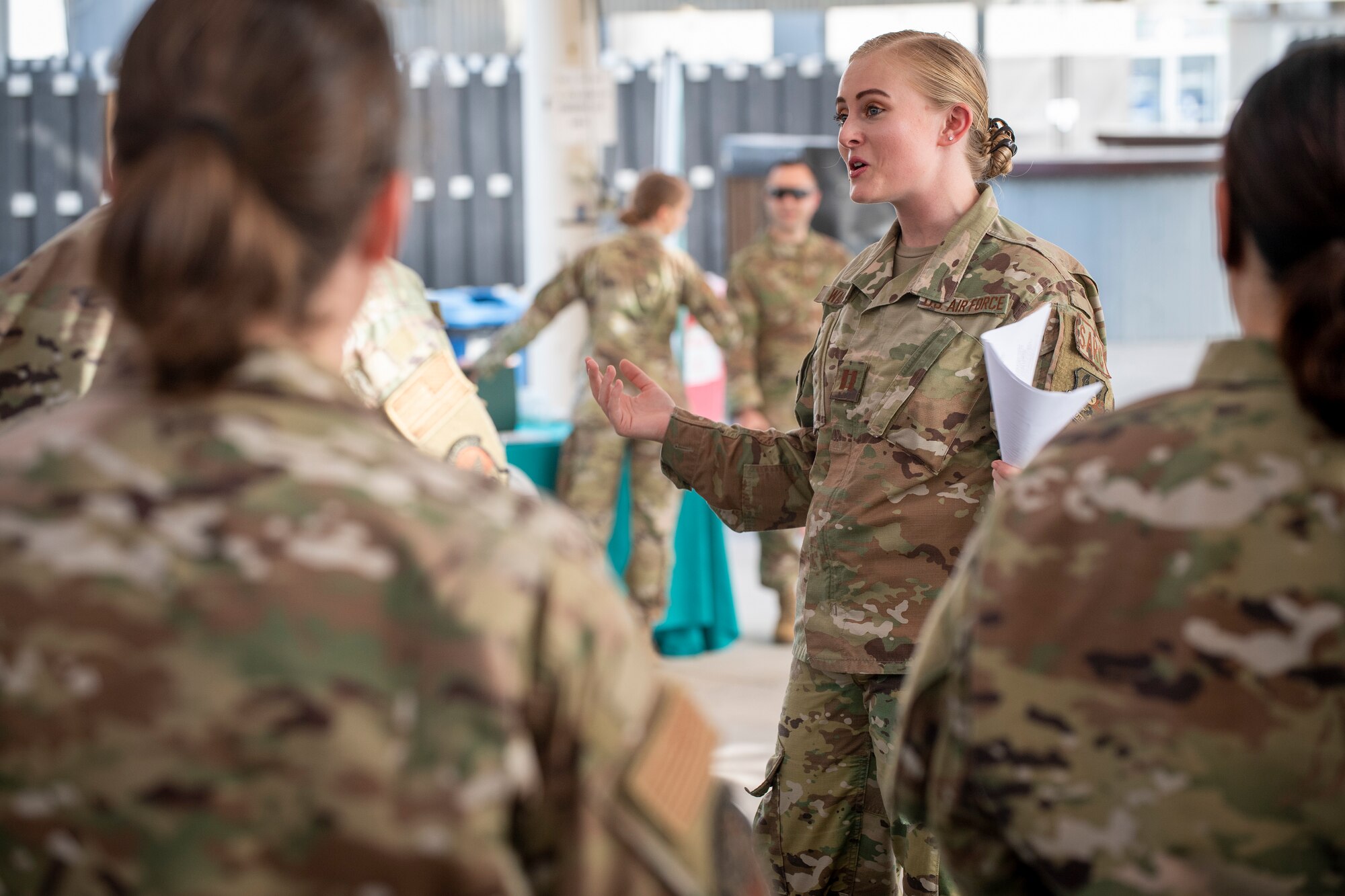 U.S. Air Force Brig. Gen. Andrew Clark, 380th Air Expeditionary Wing commander, administers an oath to the Teal Team 6 (TT6) volunteer members during the Sexual Assault Prevention and Response (SAPR), TT6 induction ceremony at Al Dhafra Air Base (ADAB) United Arab Emirates, June 18, 2021. TT6 members, take an oath to uphold a code of ethics, promote mutual respect, to support others and promise to improve the culture around them.