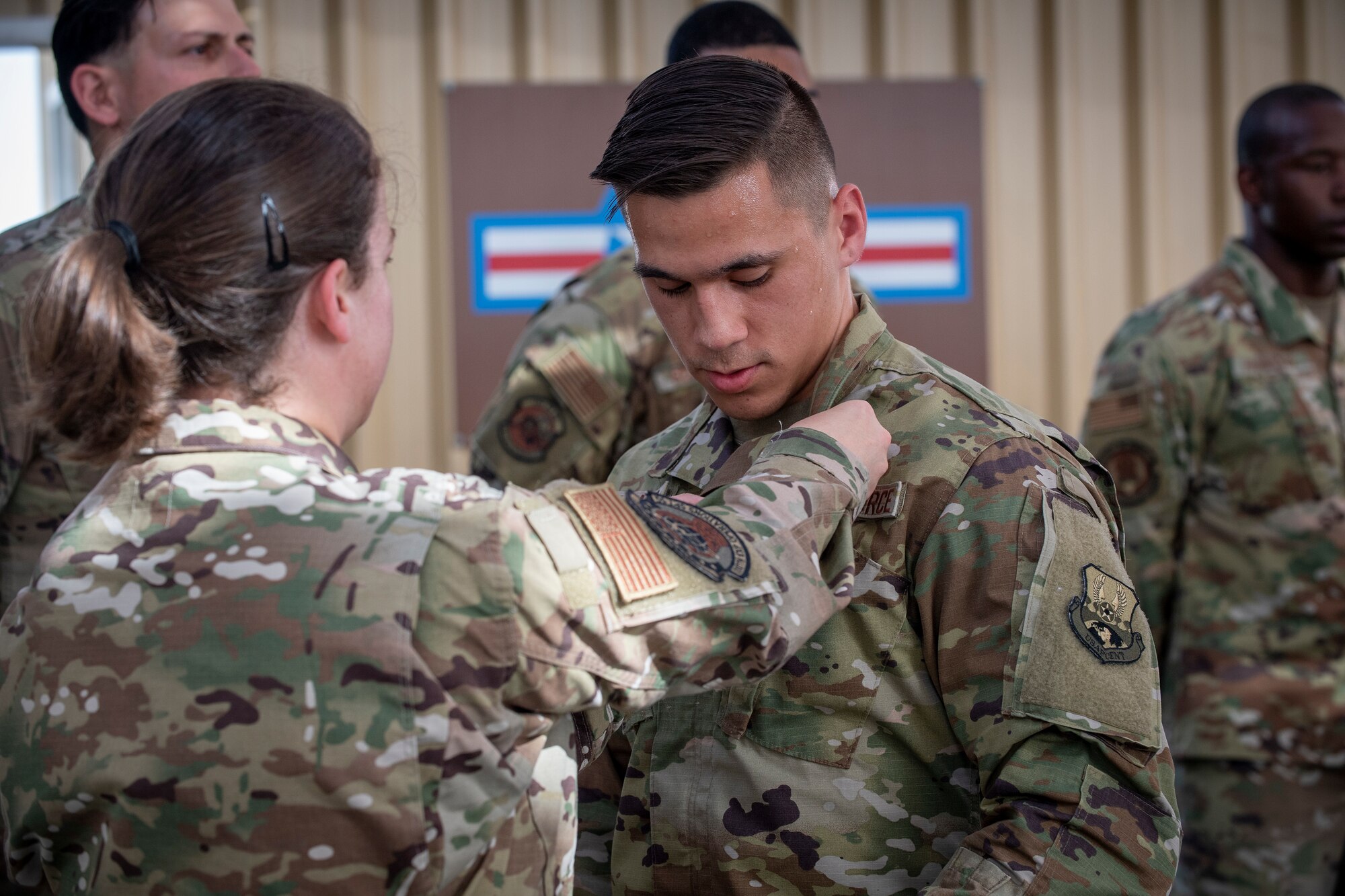 U.S. Air Force Brig. Gen. Andrew Clark, 380th Air Expeditionary Wing commander, administers an oath to the Teal Team 6 (TT6) volunteer members during the Sexual Assault Prevention and Response (SAPR), TT6 induction ceremony at Al Dhafra Air Base (ADAB) United Arab Emirates, June 18, 2021. TT6 members, take an oath to uphold a code of ethics, promote mutual respect, to support others and promise to improve the culture around them.