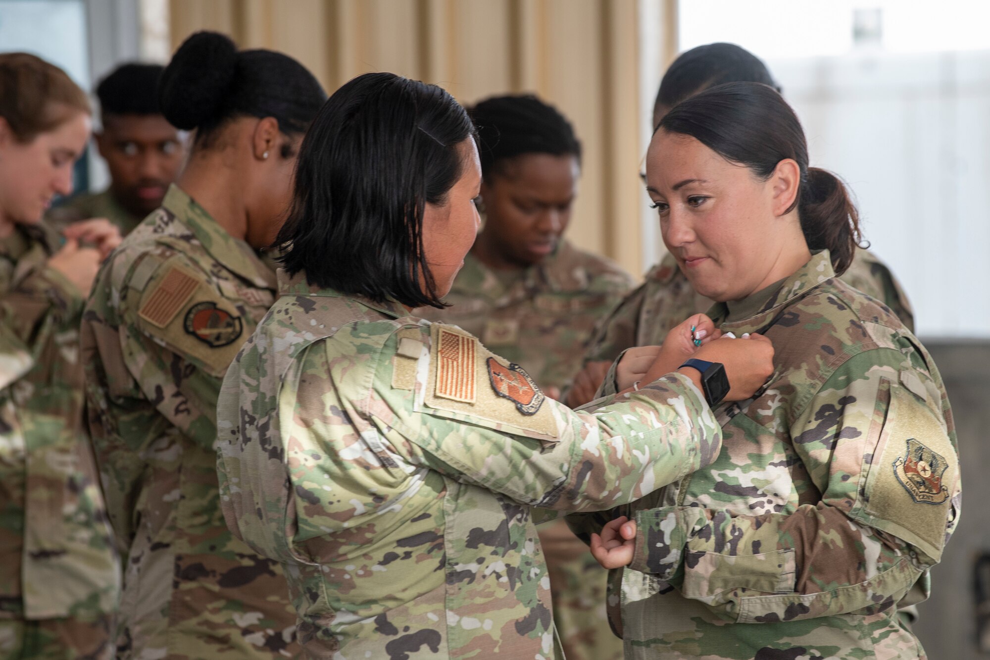 U.S. Air Force Brig. Gen. Andrew Clark, 380th Air Expeditionary Wing commander, administers an oath to the Teal Team 6 (TT6) volunteer members during the Sexual Assault Prevention and Response (SAPR), TT6 induction ceremony at Al Dhafra Air Base (ADAB) United Arab Emirates, June 18, 2021. TT6 members, take an oath to uphold a code of ethics, promote mutual respect, to support others and promise to improve the culture around them.