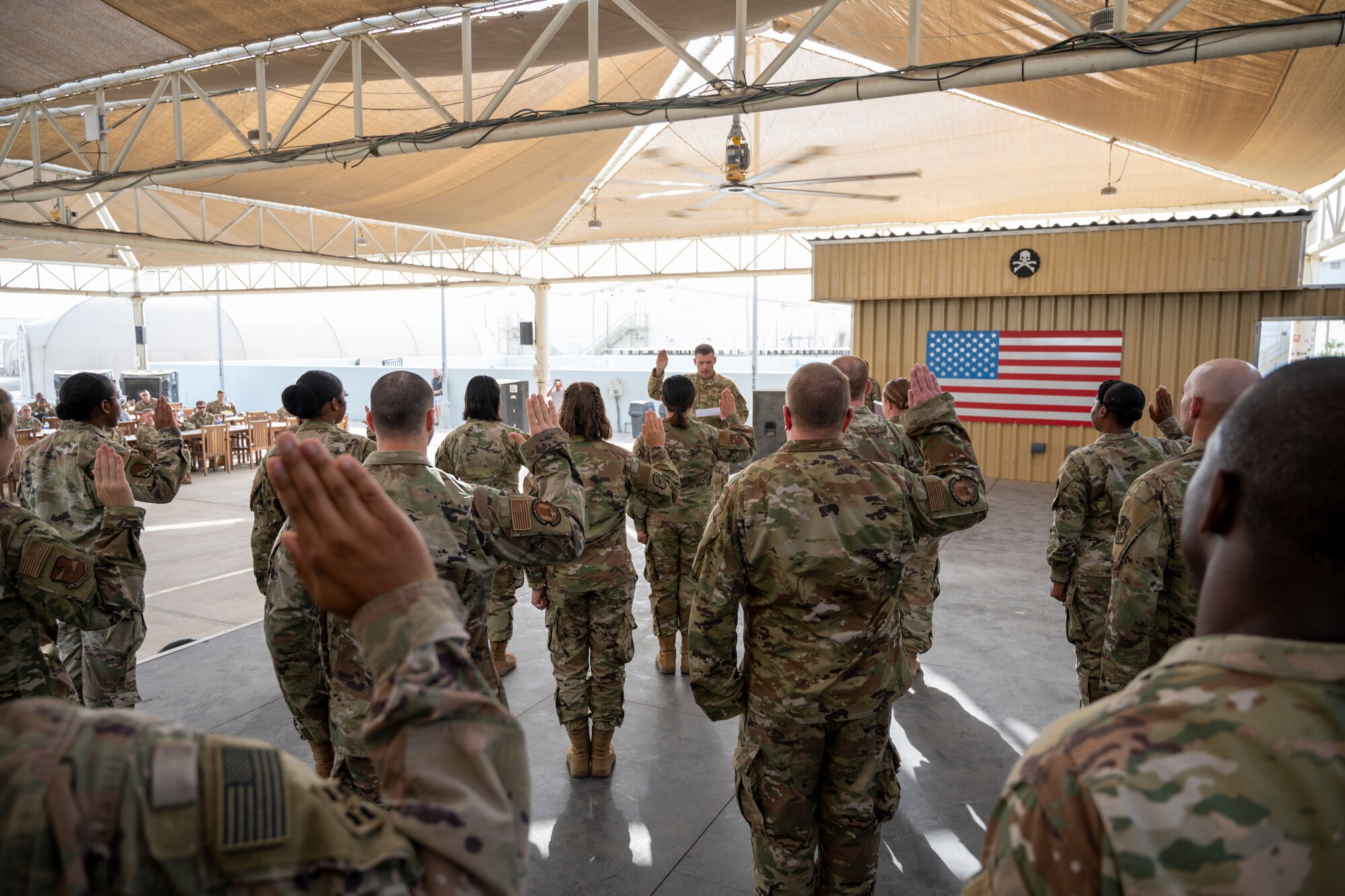 U.S. Air Force Brig. Gen. Andrew Clark, 380th Air Expeditionary Wing commander, administers an oath to the Teal Team 6 (TT6) volunteer members during the Sexual Assault Prevention and Response (SAPR), TT6 induction ceremony at Al Dhafra Air Base (ADAB) United Arab Emirates, June 18, 2021. TT6 members, take an oath to uphold a code of ethics, promote mutual respect, to support others and promise to improve the culture around them.