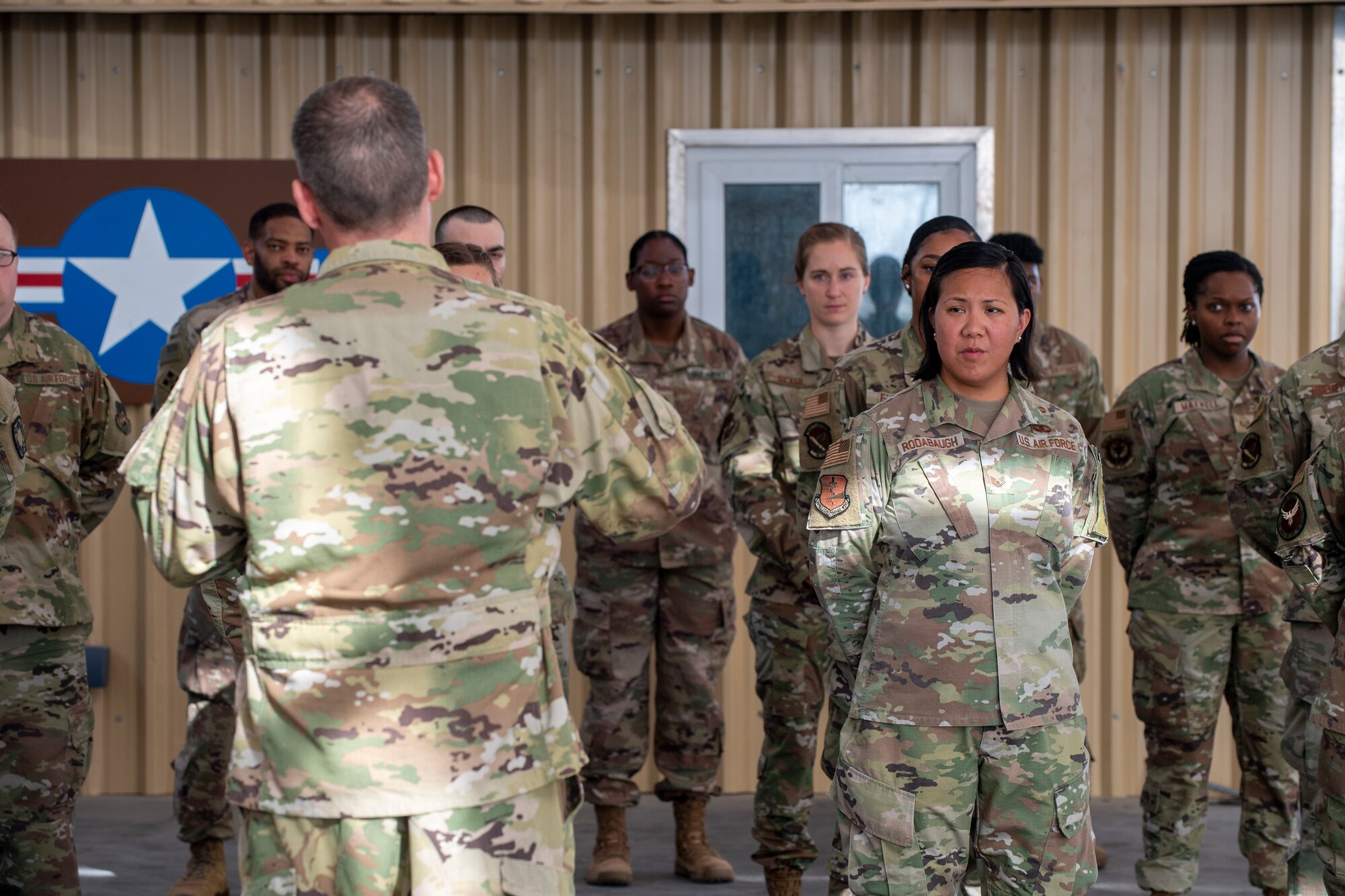 U.S. Air Force Brig. Gen. Andrew Clark, 380th Air Expeditionary Wing commander, administers an oath to the Teal Team 6 (TT6) volunteer members during the Sexual Assault Prevention and Response (SAPR), TT6 induction ceremony at Al Dhafra Air Base (ADAB) United Arab Emirates, June 18, 2021. TT6 members, take an oath to uphold a code of ethics, promote mutual respect, to support others and promise to improve the culture around them.