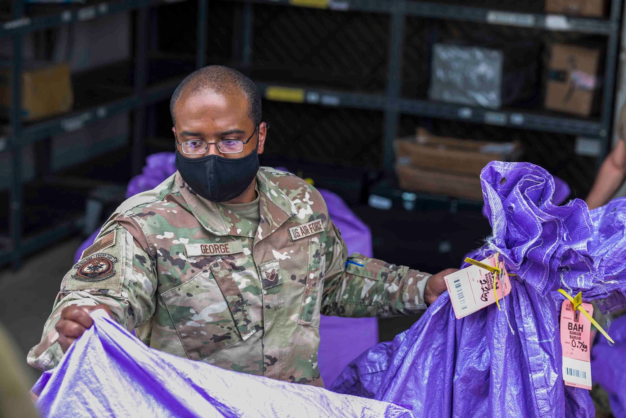 U.S. Air Force Airmen from the 380th Expeditionary Force Support Squadron, sort mail packages at Al Dhafra Air Base (ADAB), United Arab Emirates, June 16, 2021. The ADAB post office averages 52,000 lbs across 8,500 packages a month.