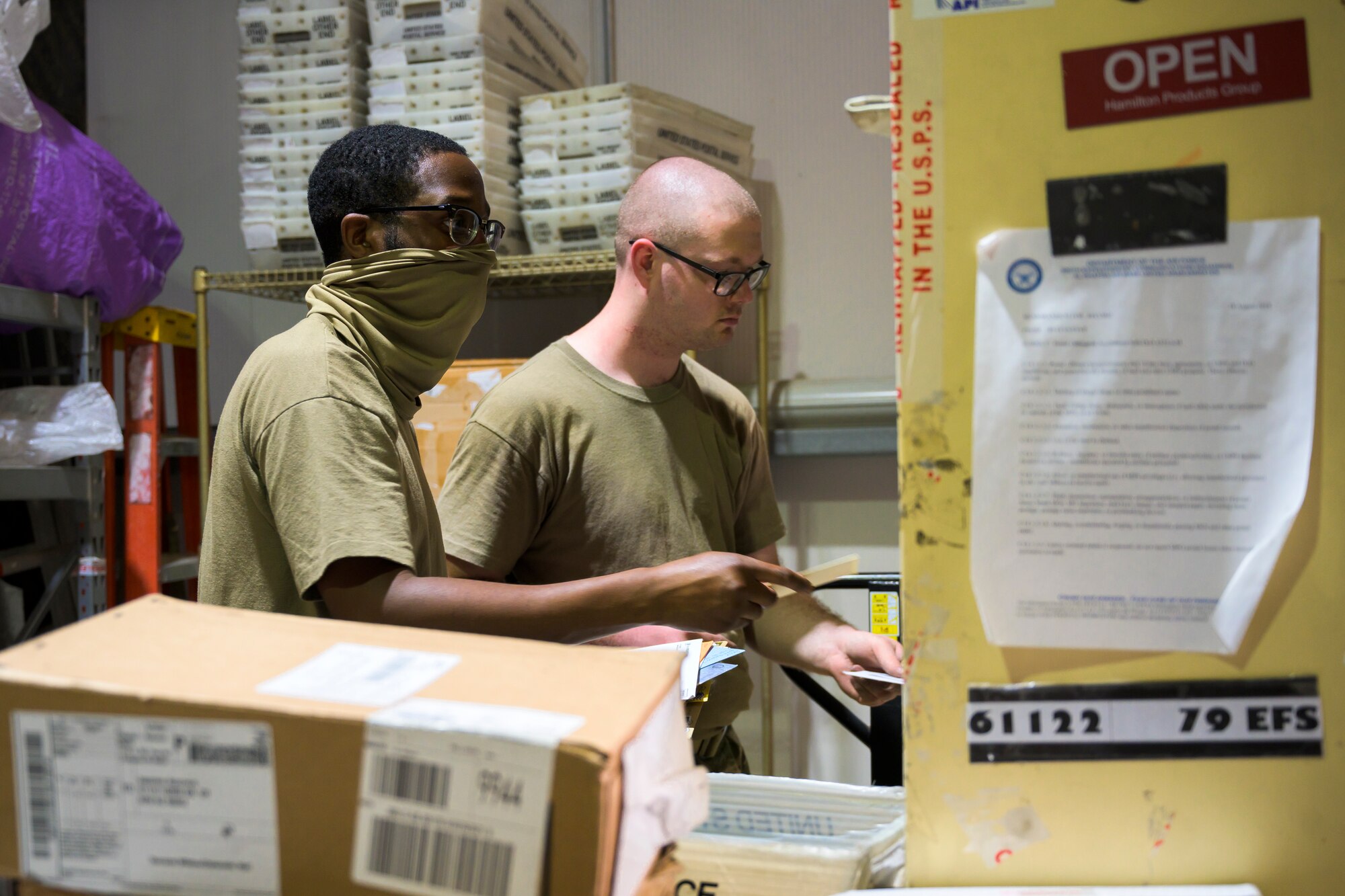 U.S. Air Force Airmen from the 380th Expeditionary Force Support Squadron, sort mail packages at Al Dhafra Air Base (ADAB), United Arab Emirates, June 16, 2021. The ADAB post office averages 52,000 lbs across 8,500 packages a month.
