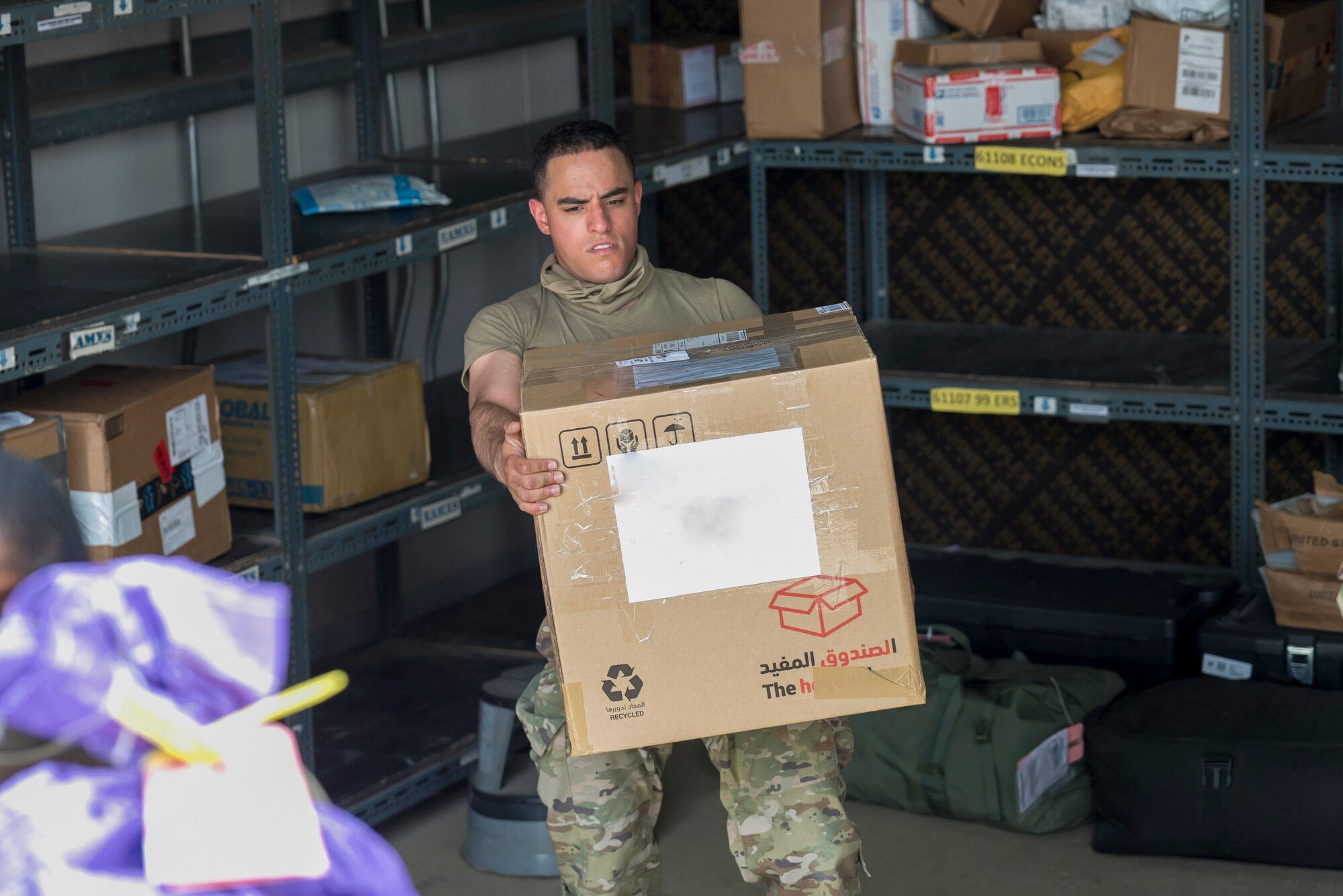 U.S. Air Force Airmen from the 380th Expeditionary Force Support Squadron, sort mail packages at Al Dhafra Air Base (ADAB), United Arab Emirates, June 16, 2021. The ADAB post office averages 52,000 lbs across 8,500 packages a month.