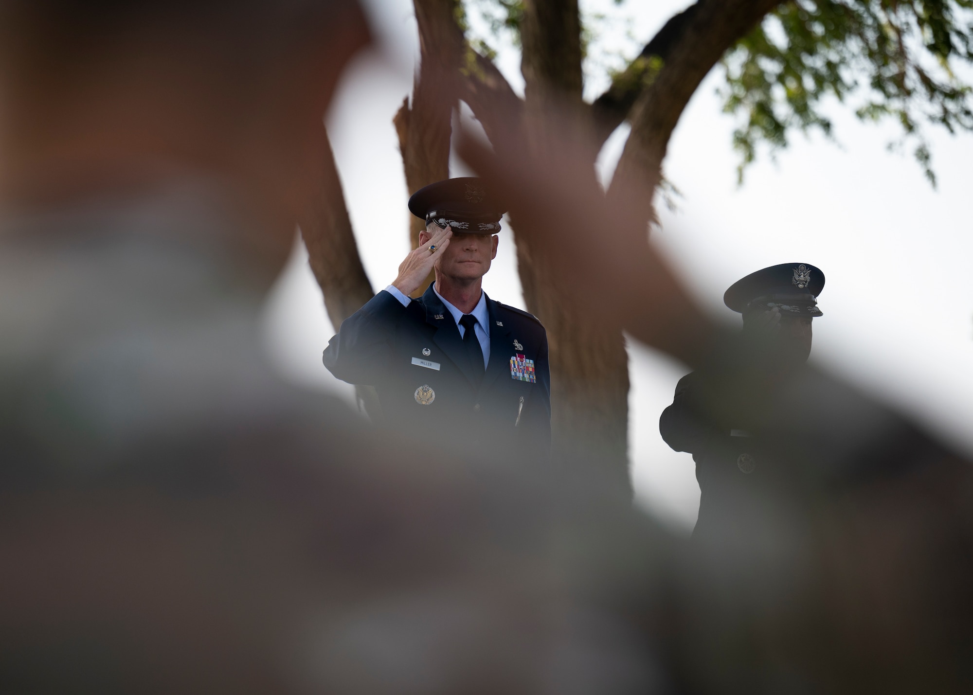 U.S. Air Force Col. David S. Miller, 377th Air Base Wing outgoing commander, renders a salute.