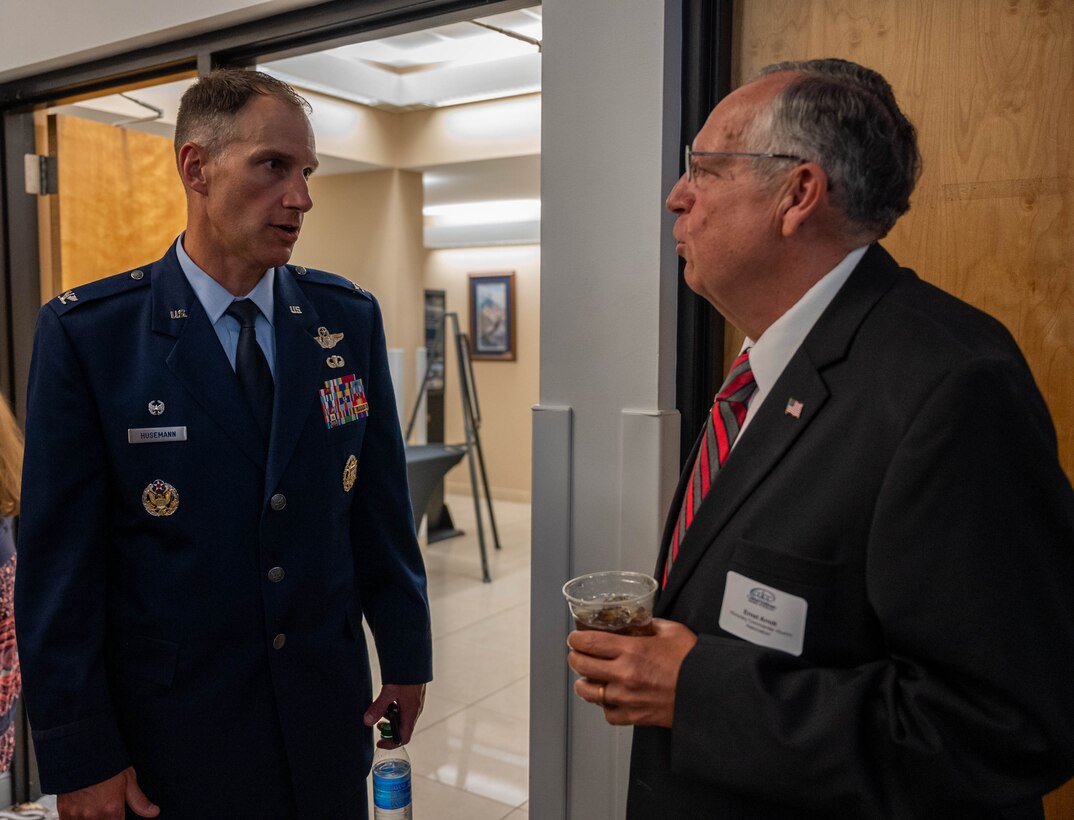 Col. Matt Husemann, 436th Airlift Wing commander, right, speaks with Judge Ernst Arndt, during the Military Affaire event at Dover Air Force Base, Delaware, June 17, 2021. The annual event brings Dover AFB and community leaders together to network and build relationships. (U.S. Air Force photo by Senior Airman Faith Schaefer)