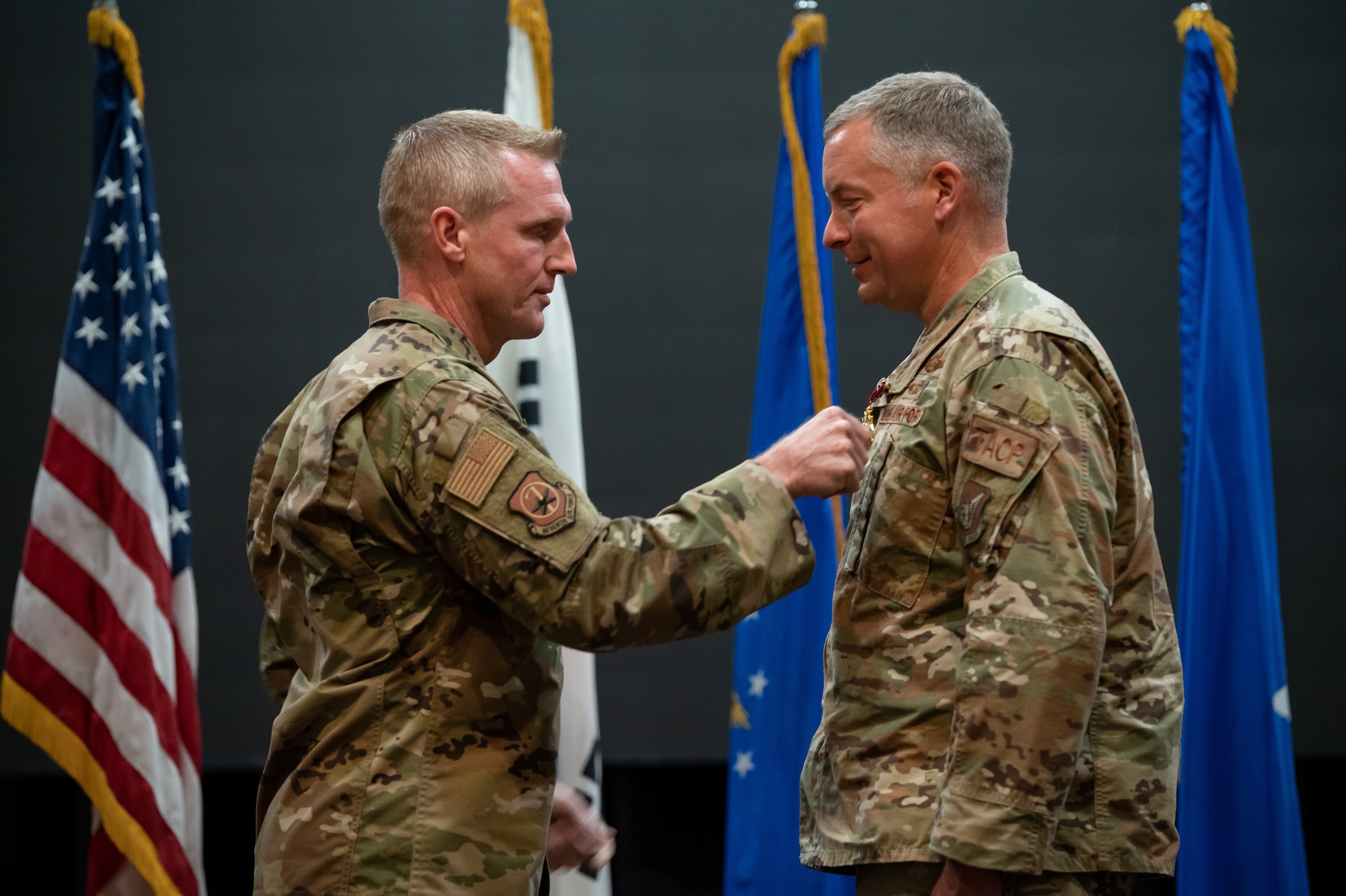 Brig. Gen. Jason Rueschhoff, 7th Air Force deputy commander, pins the Legion of Merit onto Col. Willian Edmunds, 607th Air Support Operations Group outbound commander, at Osan Air Base, Republic of Korea, June 22, 2021. Edmunds earned the Legion of Merit for his meritorious conduct as the 607th ASOG commander. (U.S. Air Force photo by Tech. Sgt. Nicholas Alder)