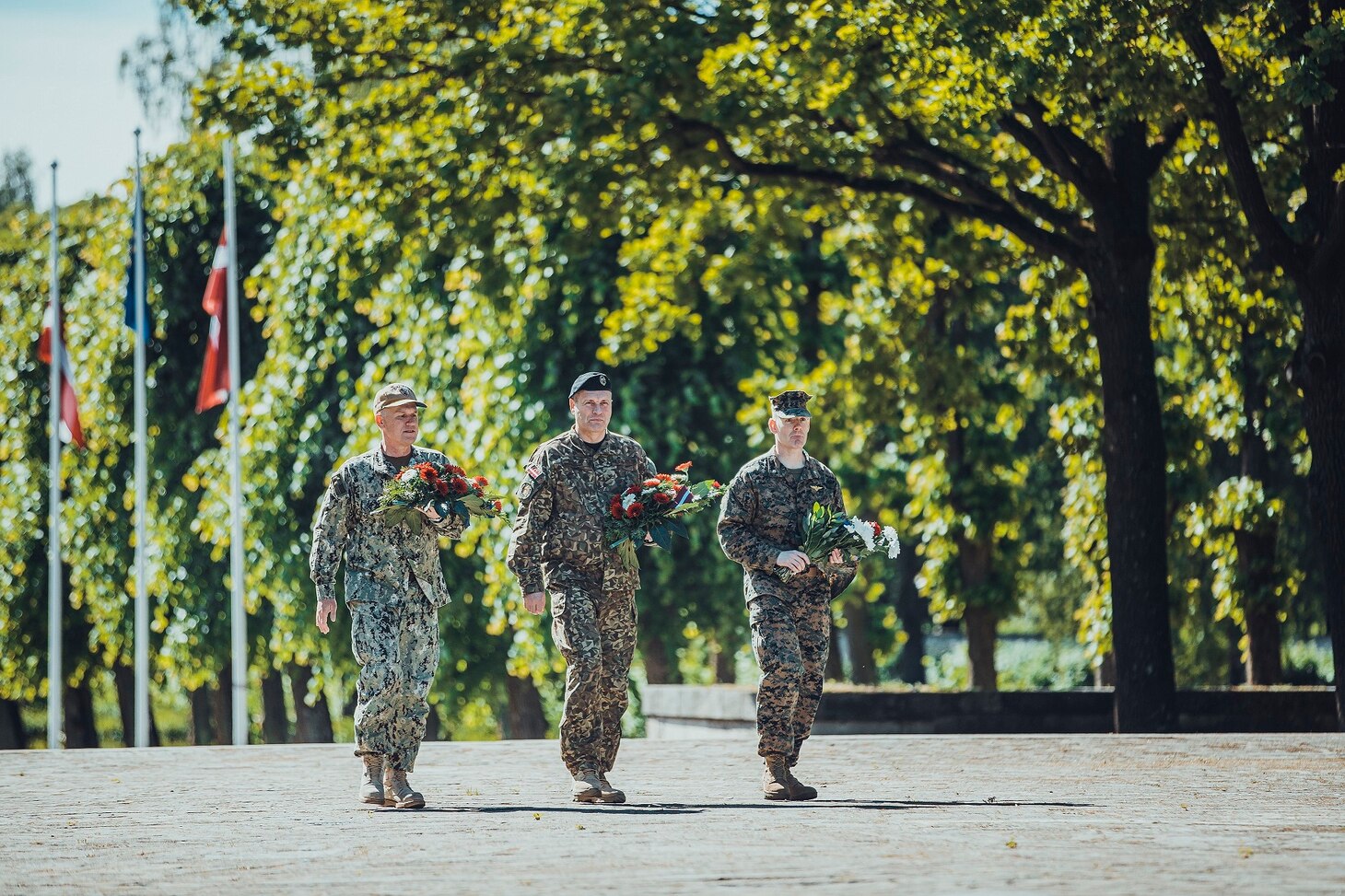 210614-N-NO901-0001 RIGA, Latvia (June 14, 2021) Latvian Chief of Defense, Lt. Gen. Leonids Kalnins,  Vice Adm. Gene Black, commander, U.S. Sixth Fleet and commander, Naval Striking and Support Forces NATO, and U.S. Marine Corps Lt. Col. Greer Chambless, senior defense official, U.S. Embassy Riga, visited Brethren Cemetery to participate in a “Day of Remembrance,” honoring those who were deported in 1941, June 14, 2021, in Riga, Latvia. The 50th BALTOPS represents a continuous, steady commitment to reinforcing interoperability in the Alliance and providing collective maritime security in the Baltic Sea. (U.S. Navy courtesy photo)