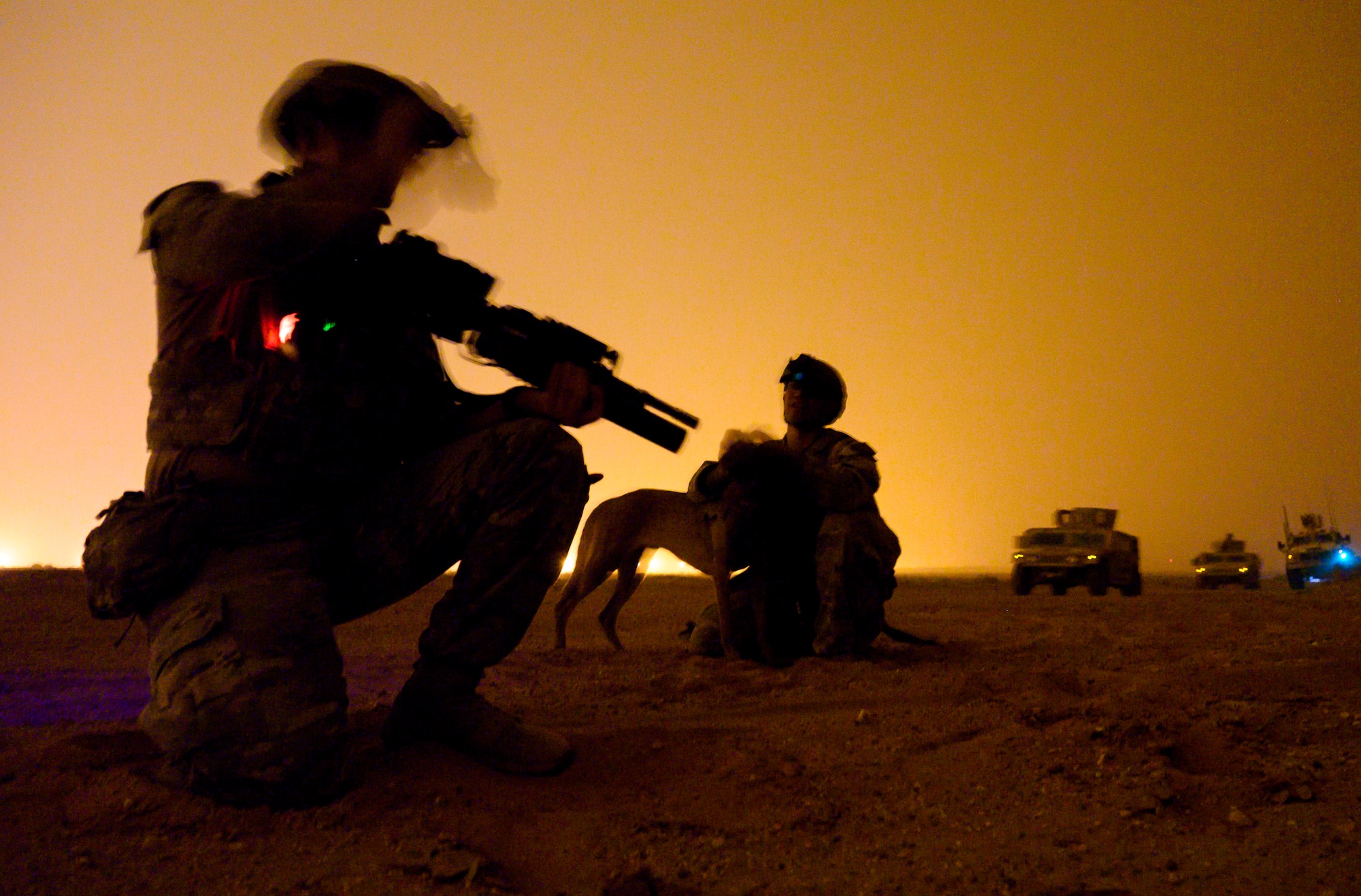 U.S. Air Force defenders with the 378th Expeditionary Security Forces Squadron act as members of a dismounted patrol during a quick response training event in blackout conditions at Prince Sultan Air Base, Kingdom of Saudi Arabia, June 12, 2021. PSAB Explosive Ordnance Disposal, Security Forces and Medical personnel participated in integrated training to bolster defensive capabilities and maintain readiness at all times. (U.S. Air Force Photo by Senior Airman Samuel Earick)