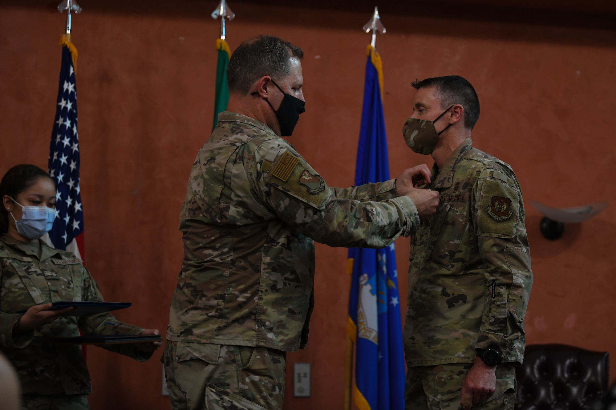 U.S. Air Force Col. Wade Adair, 31st Medical Group commander, left, pins the Meritorious Service Medal (MSM) on U.S. Air Force Col. Mark Roberts, 31st Dental Squadron outgoing commander, at Aviano Air Base, Italy, June 22, 2021. The MSM is a military award presented to members of the United States Armed Forces who distinguished themselves by outstanding meritorious achievement. (U.S. Air Force photo by Airman First Class Taryn Onyon)