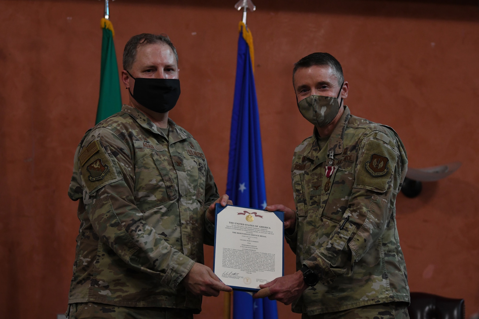 U.S. Air Force Col. Wade Adair, 31st Medical Group commander, left, and U.S. Air Force Col. Mark Roberts, 31st Dental Squadron (DS) outgoing commander, pose for a photo during a change of command at Aviano Air Base, Italy, June 22, 2021. The 31st DS integrates community-based preventive dental services and utilizes all dental resources to enable peak mission readiness and sustained performance. (U.S. Air Force photo by Airman First Class Taryn Onyon)