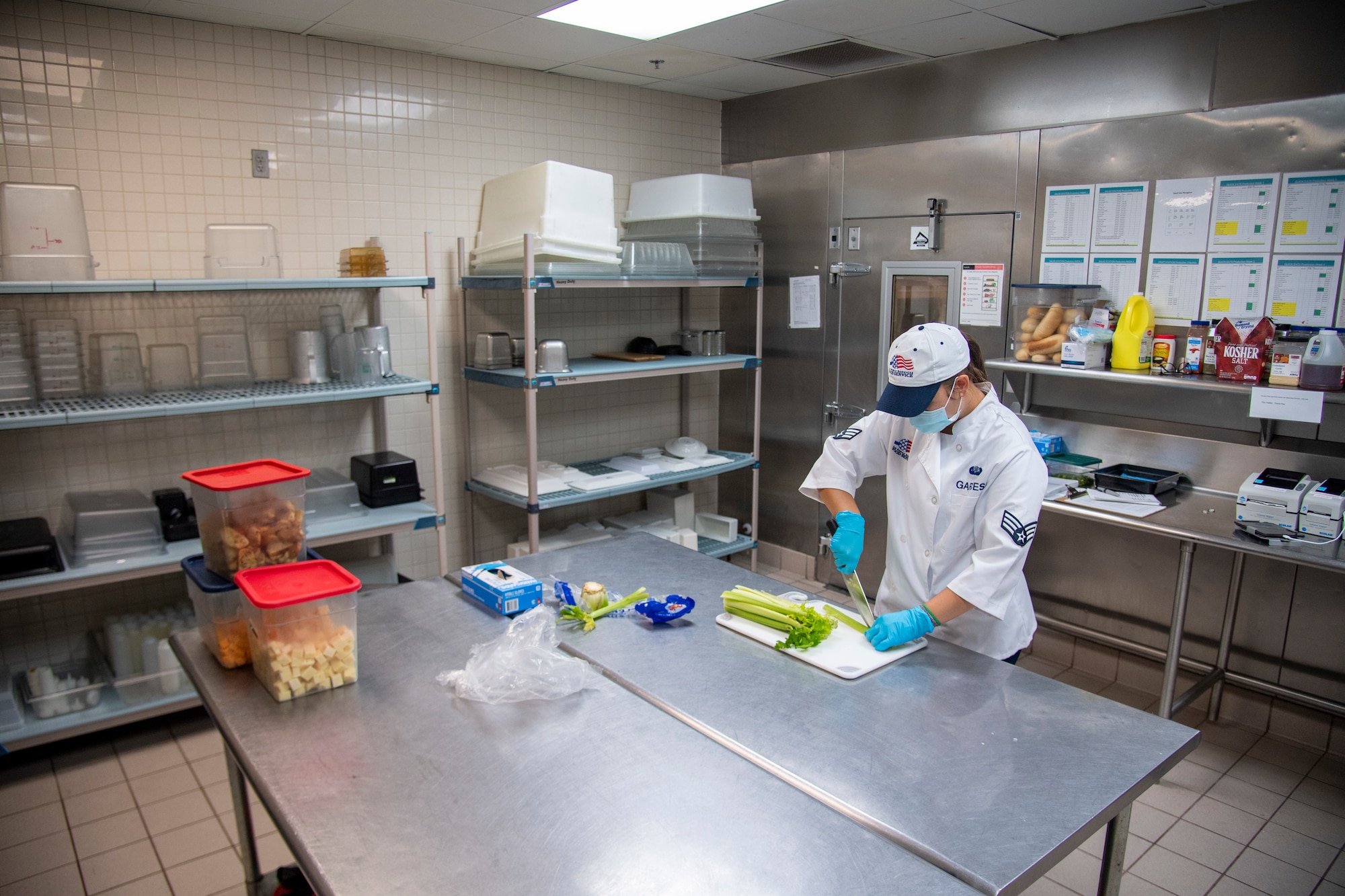 U.S. Air Force Senior Airman Haley Garces, 6th Force Support Squadron food services journeyman, prepares food for service members at MacDill Air Force Base, Florida, June 15, 2021.