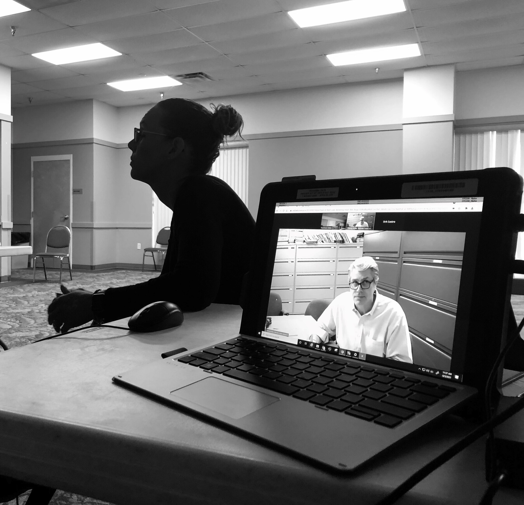 A man participates in a Pitch Day event via zoom.