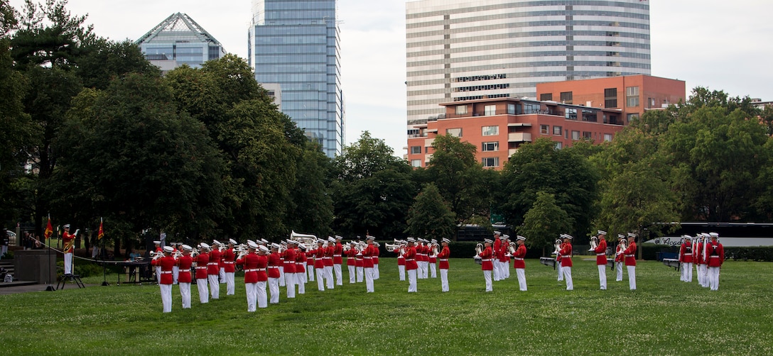 Marines with “The Commandant’s Own,” U.S. Marine Drum and Bugle Corps perform during a Tuesday Sunset Parade at the Marine Corps War Memorial, Arlington, VA, June 23, 2021. Major Gen. Julian D. Alford, commanding general, Training Command, was the hosting official and Dr. Salim Lala, assistant professor of surgery, Division of Vascular Surgery – Department of Surgery, the GW Medical Facility Associates, Washington D.C., was the guest of honor. (U.S. Marine Corps photo by Lance Cpl. Mark Morales)