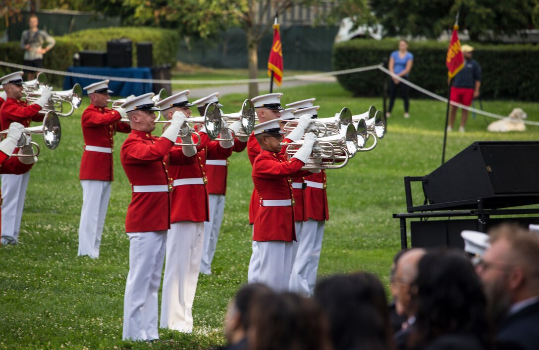 Marines with “The Commandant’s Own,” U.S. Marine Drum and Bugle Corps perform during a Tuesday Sunset Parade at the Marine Corps War Memorial, Arlington, VA, June 23, 2021. Major Gen. Julian D. Alford, commanding general, Training Command, was the hosting official and Dr. Salim Lala, assistant professor of surgery, Division of Vascular Surgery – Department of Surgery, the GW Medical Facility Associates, Washington D.C., was the guest of honor. (U.S. Marine Corps photo by Lance Cpl. Mark Morales)